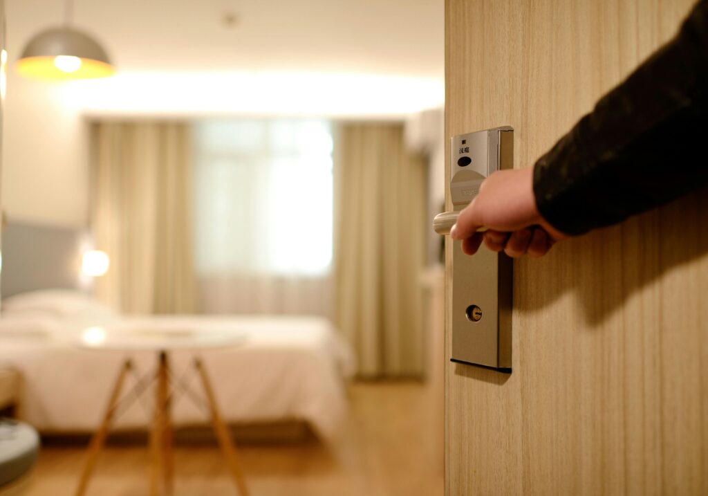 pexels-photo-271639-271639 Person Holding on Door Lever Inside Room